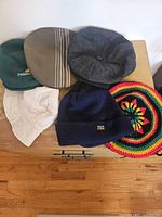Overview of six hats on dresser