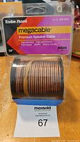 Front of package showing Radio Shack megacable premium speaker cable spool