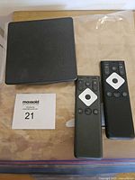 Top view of Xi6-A box with two XR15 remotes