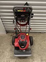 Front view of Briggs & Stratton Elite Series pressure washer showing the red engine and wheels.