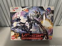 Front box image of the Bandai VF-25F Tornadomessiah model kit showing box art and product information.