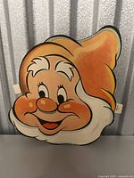 Front side of vintage Dopey mask in bright colors showing character details and condition