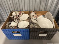 Two cardboard boxes packed with assorted white porcelain and Royal Albert patterned pieces