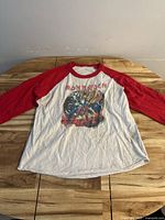 Full front view of white and red raglan tee laid flat to show overall style and condition
