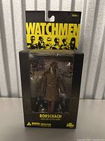 Front view of Rorschach action figure in original sealed Series 1 Watchmen packaging.