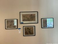 Four framed Asian inspired art prints hanging on a wall, showing size and framing style.