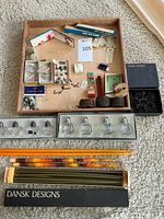 Top view of the entire lot showing boxed items, salt and pepper shakers, candles, and smaller decorative pieces