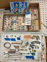 Overview of two boxes of mixed stamps and tray of jewelry pieces