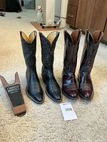 Main shot showing both pairs of boots side by side with boot stretcher visible