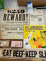 Overview of all items including posters, Playgirl magazine, baby bracelet, and diaper pins on display.