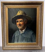 Full view of framed painting showing subject and frame details