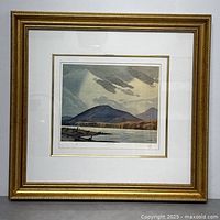Full view of framed print showing mat, frame and glass reflection