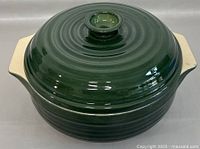 Top view of the green ceramic lidded casserole dish showing the lid and knob handle with concentric ridges