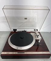 Front-left view of JVC QL-Y3F turntable with dust cover open showing platter and tonearm