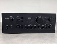 Front view of black Sansui AU-717 integrated amplifier showing control knobs and switches on front panel