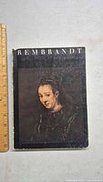 Front cover of the 1969 Rembrandt art book showing a Rembrandt portrait painting and the title "REMBRANDT".