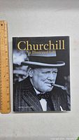Front cover of the Churchill book showing Winston Churchill with a cigar in black and white photo.
