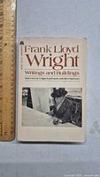 Front cover of Frank Lloyd Wright book showing title, editors, and photo of Wright.