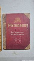Front cover of the Freemasonry book showing title, author, and detailed aged design.