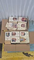 Multiple boxed quantities of 'Second Chance At Love' romance paperback books with illustrated covers show various romantic couple scenes.