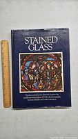 Front cover of the Stained Glass book with title and author information.