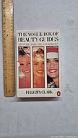 Front cover of The Vogue Box of Beauty Guides book set, showing the title, subtitle, and author Felicity Clark along with photos of three women smiling.