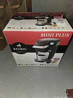 Box of Keurig Mini Plus single cup coffee maker, showing front with product image and branding