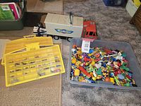 Overall view of Micro Machines cases and bin of toys