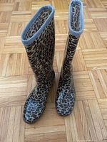 Top front view of the animal print tall rain boots showing the overall print and shape