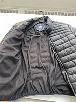 Front inside view showing black fleece lining and zipper