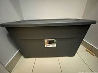 Front view of the large grey Sterilite storage bin with lid showing size and label on bin.