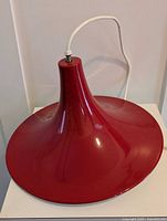 overall view of red pendant light on table