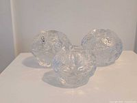 Three Kosta Boda snowball votives front view