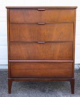 Front view of Kaufman highboy dresser showing four drawers and overall design