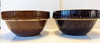 Side view of both stoneware bowls showing picket fence pattern