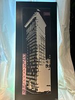 Full view of the tall rectangular black and white serigraph of Flatiron Building showing the architectural details and text elements.
