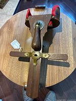 Top view showing the wooden handle, brass hardware, and red felt lining inside the stereoviewer.