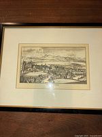 Framed black and white antique etching showing Lucerne city with mountainous landscape, mounted and framed.
