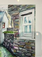 Close-up showing a segment of the watercolor painting focusing on a window set in a stone wall and part of the alley.