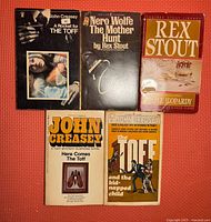 Photo showing five books: A Rocket for the Toff, The Mother Hunt, Triple Jeopardy, Here Comes The Toff, The Toff and the Kidnapped Child