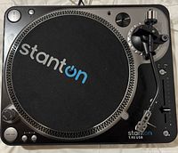 Top view of Stanton T.92 USB turntable showing the slipmat with large Stanton logo, tonearm, and controls.