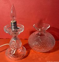 Clear Waterford crystal electric lamp base and separate glass chimney showing diamond cut pattern and electric bulb fixture.