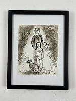 Framed lithograph by Marc Chagall showing complete piece with white mat and black frame.