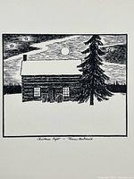 Close-up photo of the black and white print depicting a snowy cabin at night with moon and stars, titled "Christmas Night - Thoreau Macdonald"
