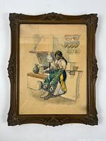 Frontal view of the framed watercolour painting by Karoly Muhlbeck depicting a woman sewing with home interior background.