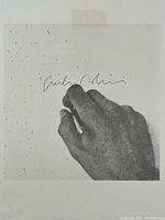 Close-up view of recto showing printed image, pencil signature and scattered marks