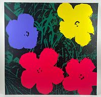 Front view of silkscreen print showing four stylized flowers in purple, yellow, and red on green foliage with black background