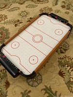 Diagonal view of entire tabletop air hockey unit