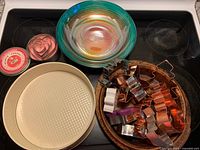 Overall lot showing cookie cutters, glass bowl, pans, tin