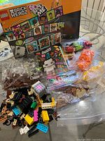 Outer box, instruction manual, unsorted and bagged bricks visible